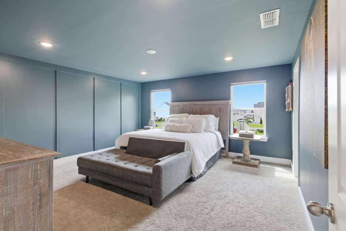 Color-drenched primary retreat with a rich, cohesive feel designed for comfort and privacy