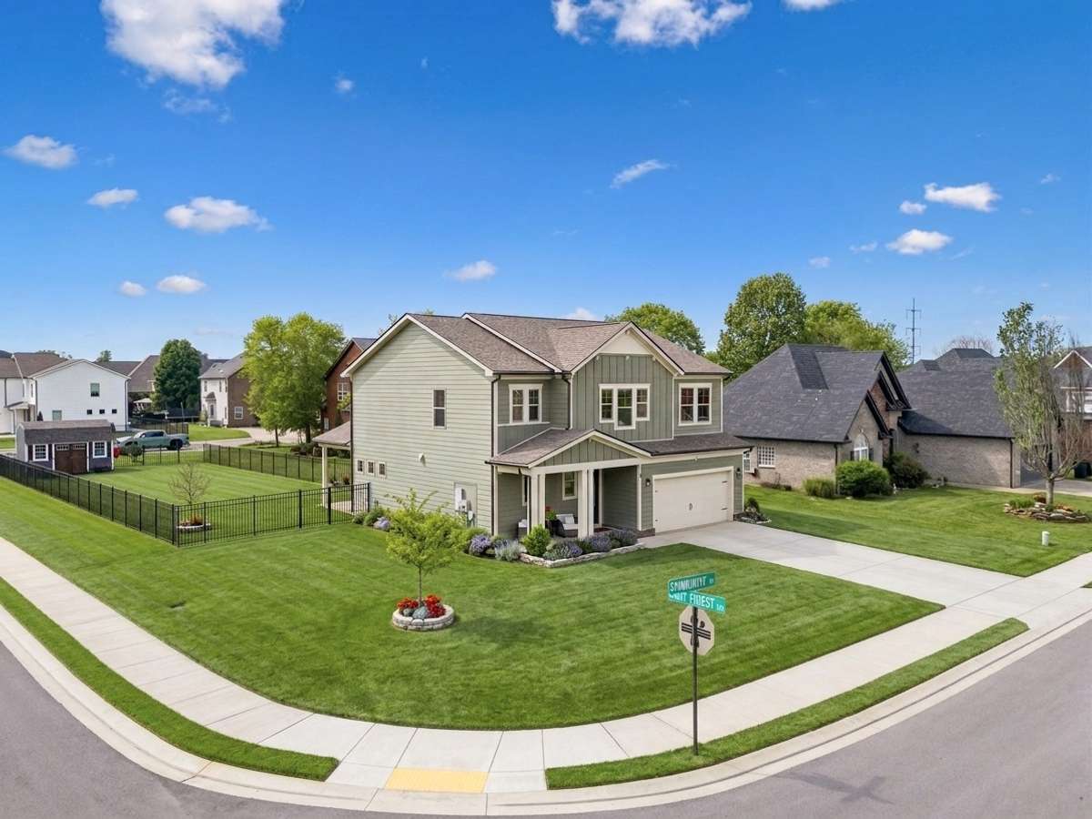 Perfectly positioned on a *double* corner lot near the neighborhood entrance, offering added space, presence, and easy in-and-out access