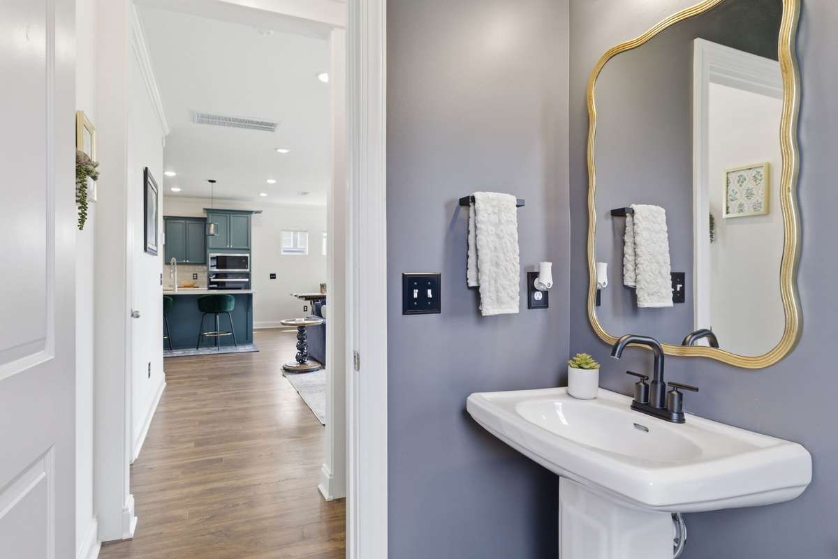 Powder bath located directly off of living area and office