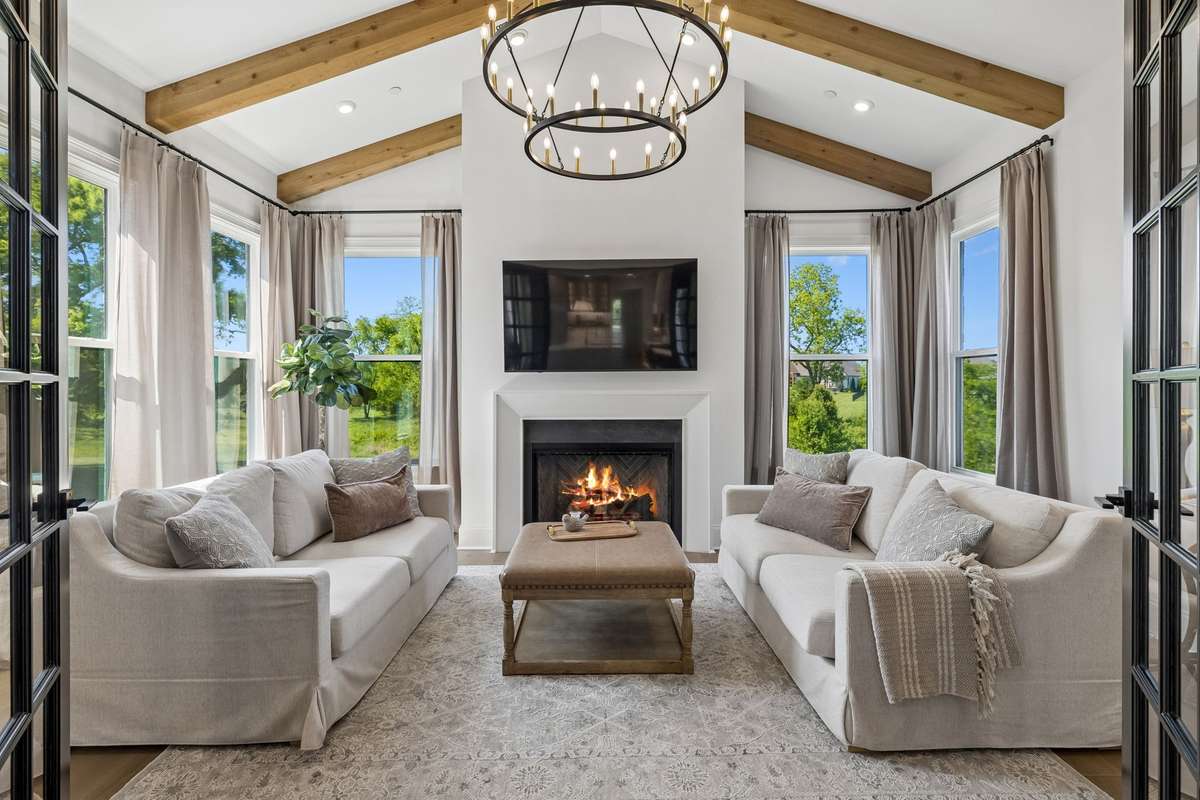The Sun Room is a special room, featuring french doors, a gas burning fireplace and a beautiful chandelier. Totally surrounded by windows and light, this space is perfect for reading or more intimate gatherings.