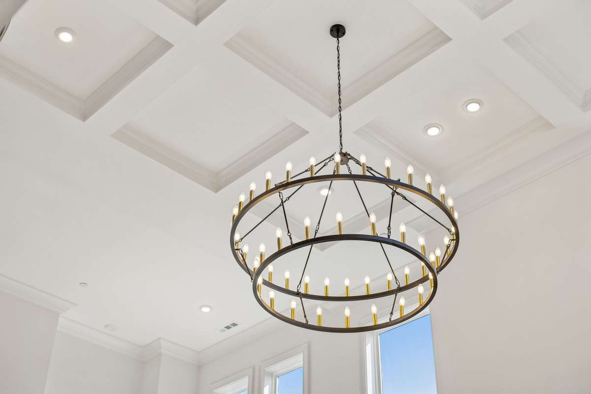 The coffered ceiling and abundance of natural light in the main Living Room make it a true showstopper