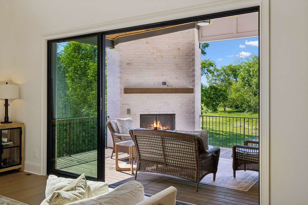 Glass sliders in the living room open up the the patio space