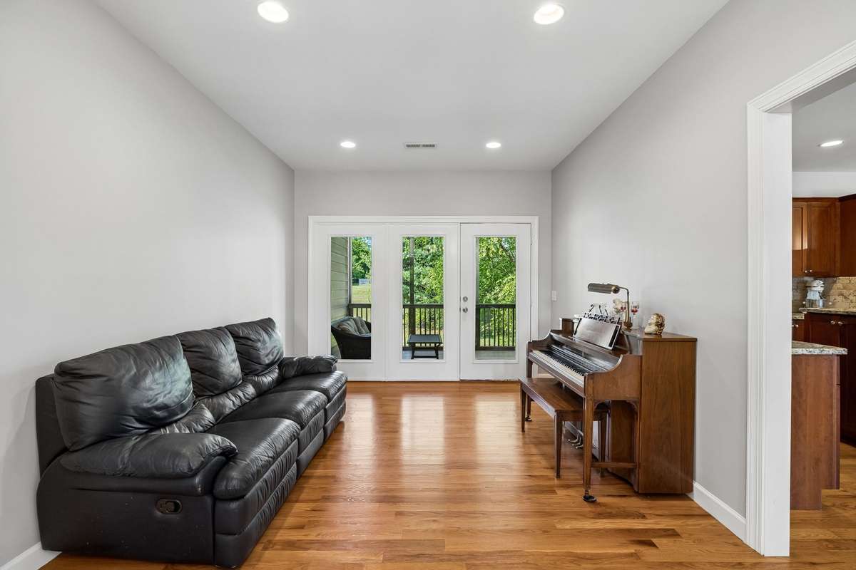 Sitting area off the kitchen. Doors open to a Large private deck