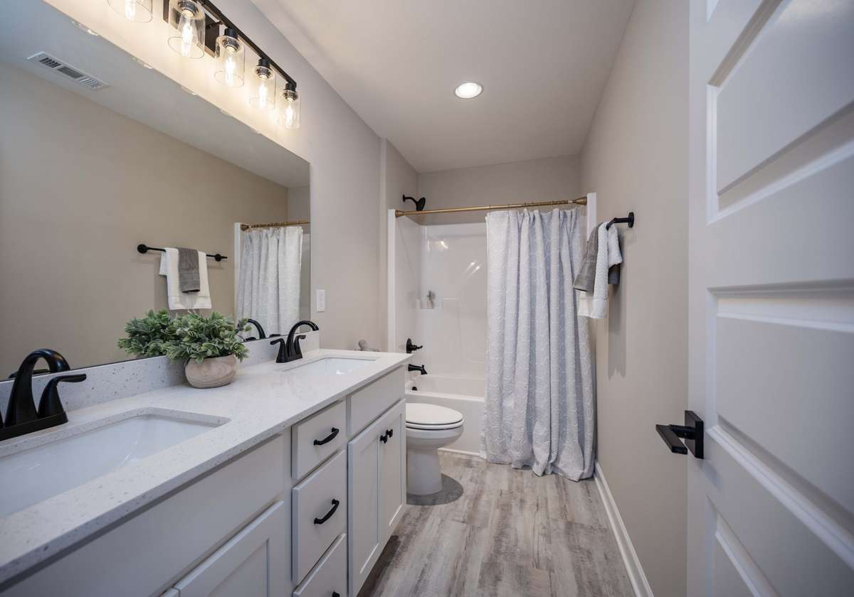 Photo from previous build of the same plan. 2nd bath upstairs between bedrooms.