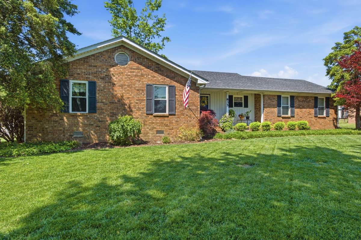 Timeless curb appeal with established landscaping and a warm, inviting presence.