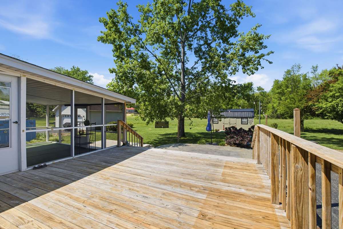 Virtually staged - Spacious deck overlooking a private backyard - - perfect for relaxing or entertaining.