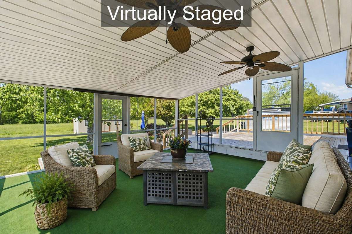 Virtually staged to show that you can Enjoy the outdoors year-round from this spacious screened-in patio - - perfect for relaxing or entertaining.