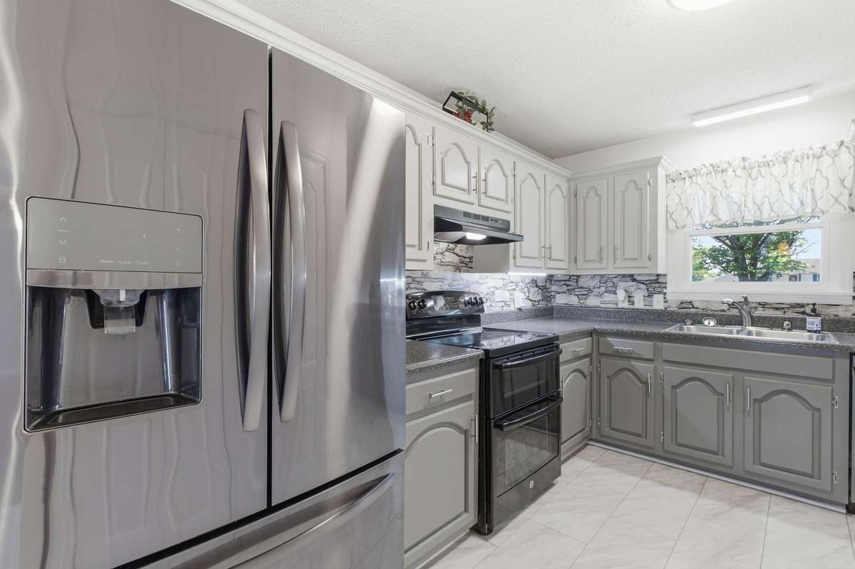 Stainless appliances and a functional layout designed for easy cooking flow.