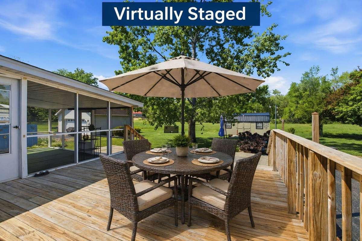 Virtually staged to show to show Large deck + peaceful backyard views = your new favorite place to unwind.