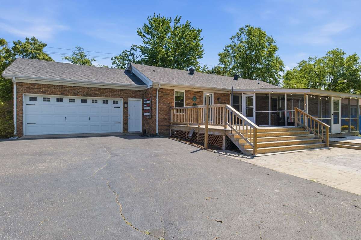 Ample parking and easy access with a spacious driveway and attached garage.