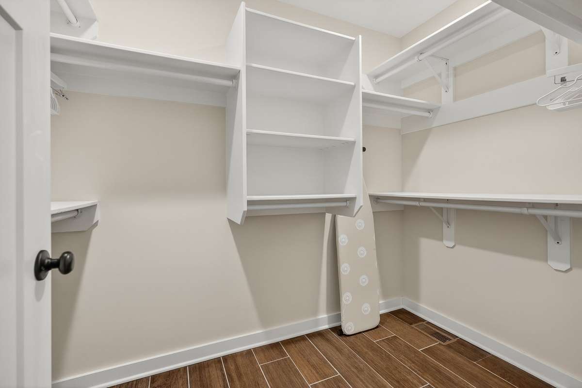 Custom primary walk-in closet.