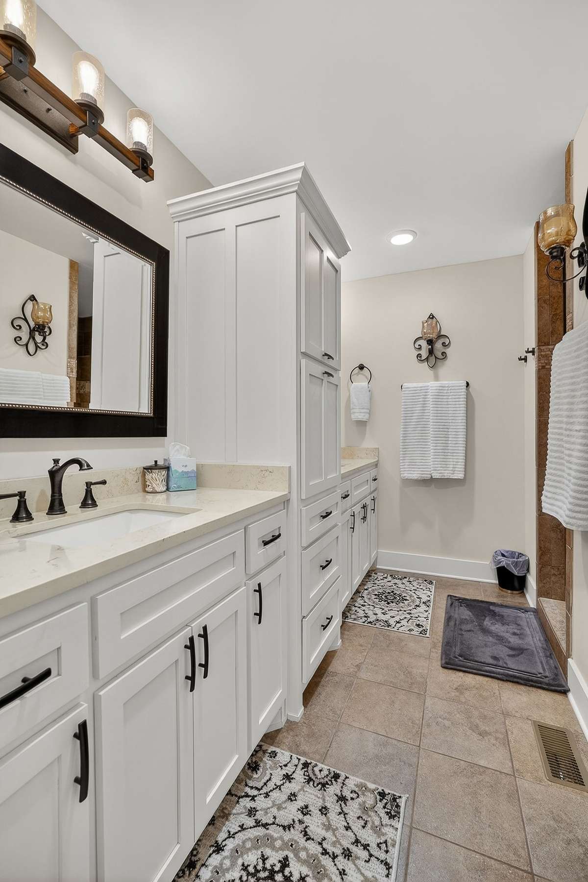 Dual vanities and a separate water closet.