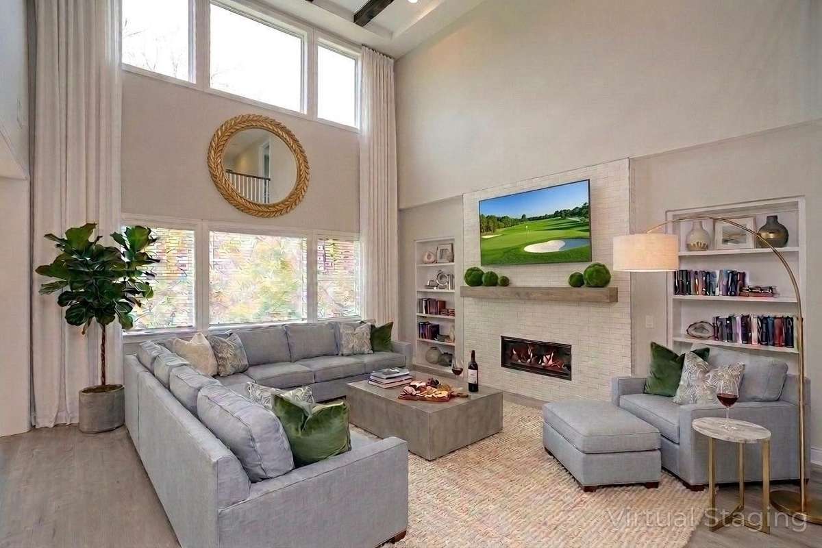 Staged family room open to gourmet kitchen/dining area
