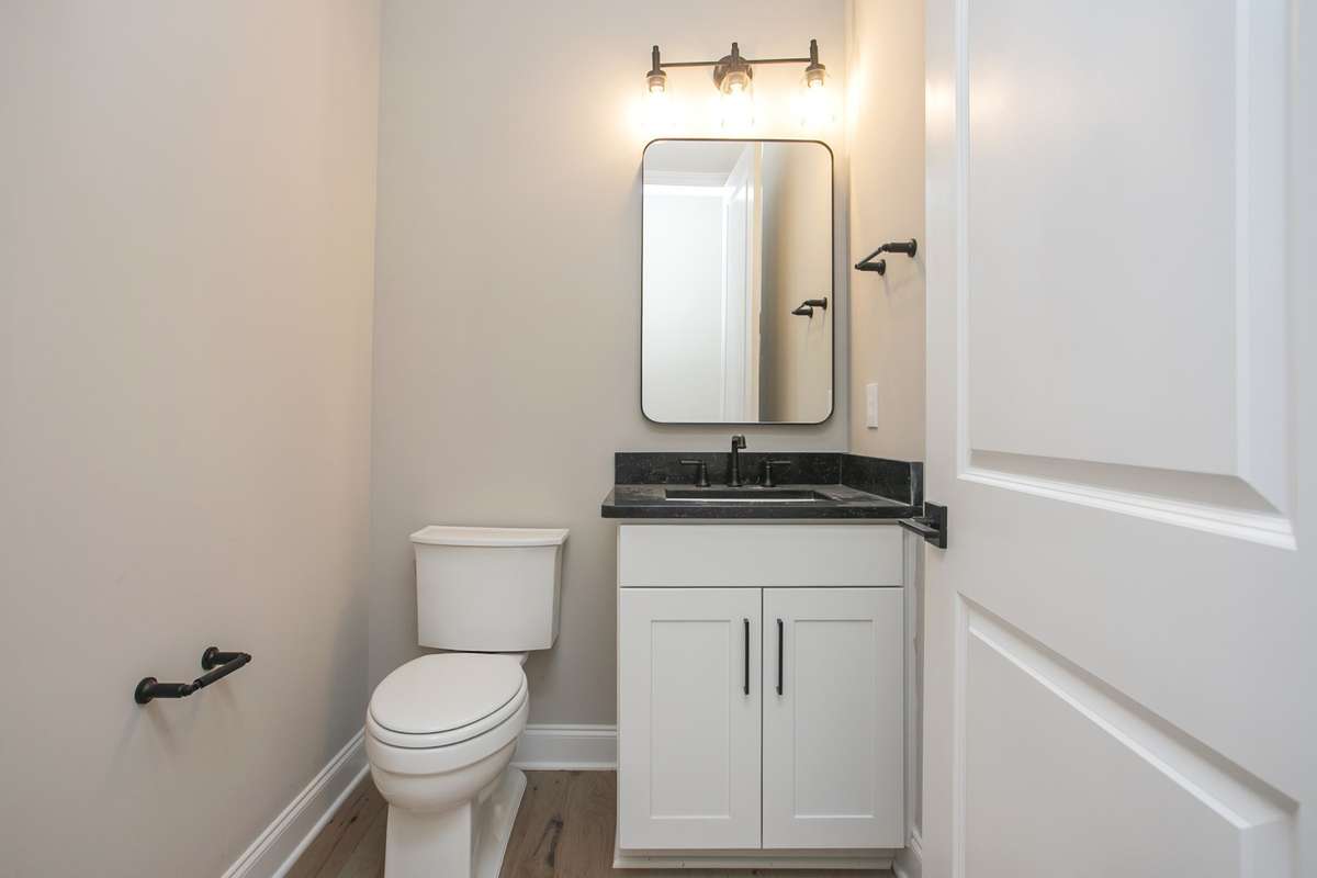 Powder room on first floor off family room/foyer area