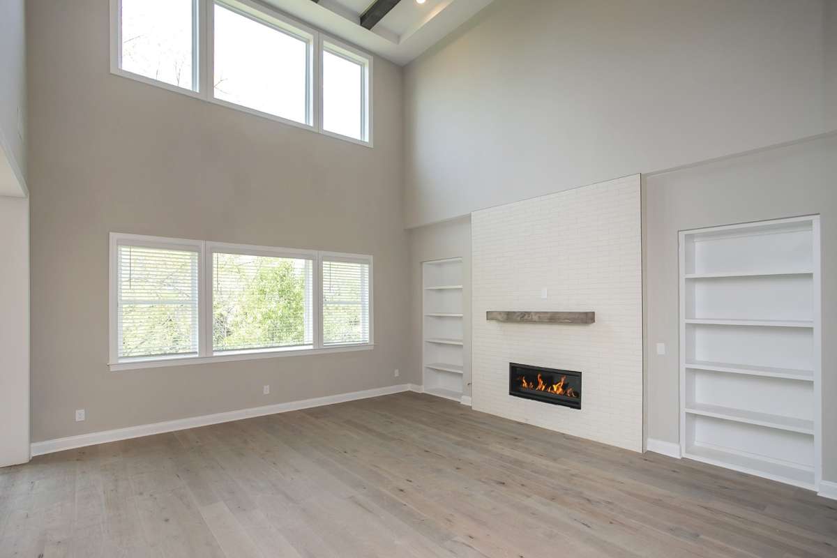 Family room off open gourmet kitchen/dining area