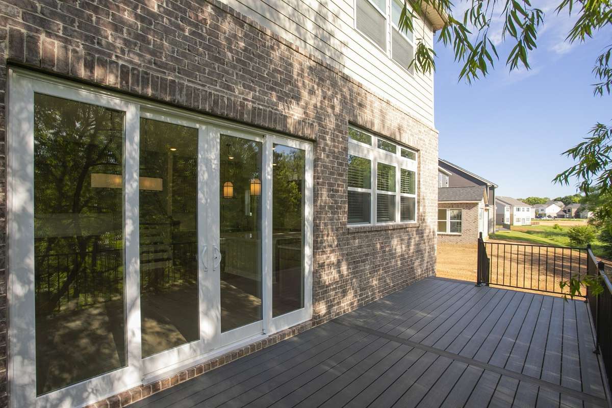 Private deck off of gourmet kitchen and dining area