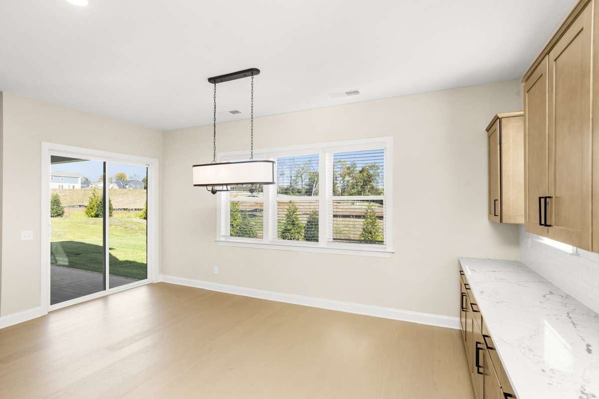 Dining area with a view out onto the patio and back yard