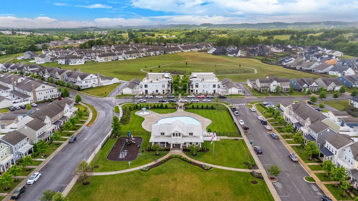 Welcome to Harvest Point's amenities, including a resort style pool, clubhouse, dog park, shops, walking trails, kids' playground and community garden.