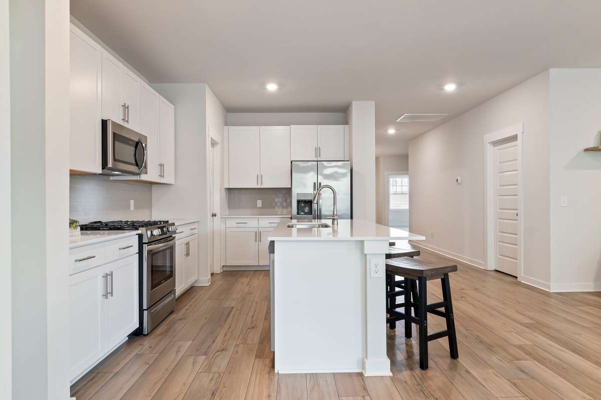 These stainless steel appliances convey with the home.