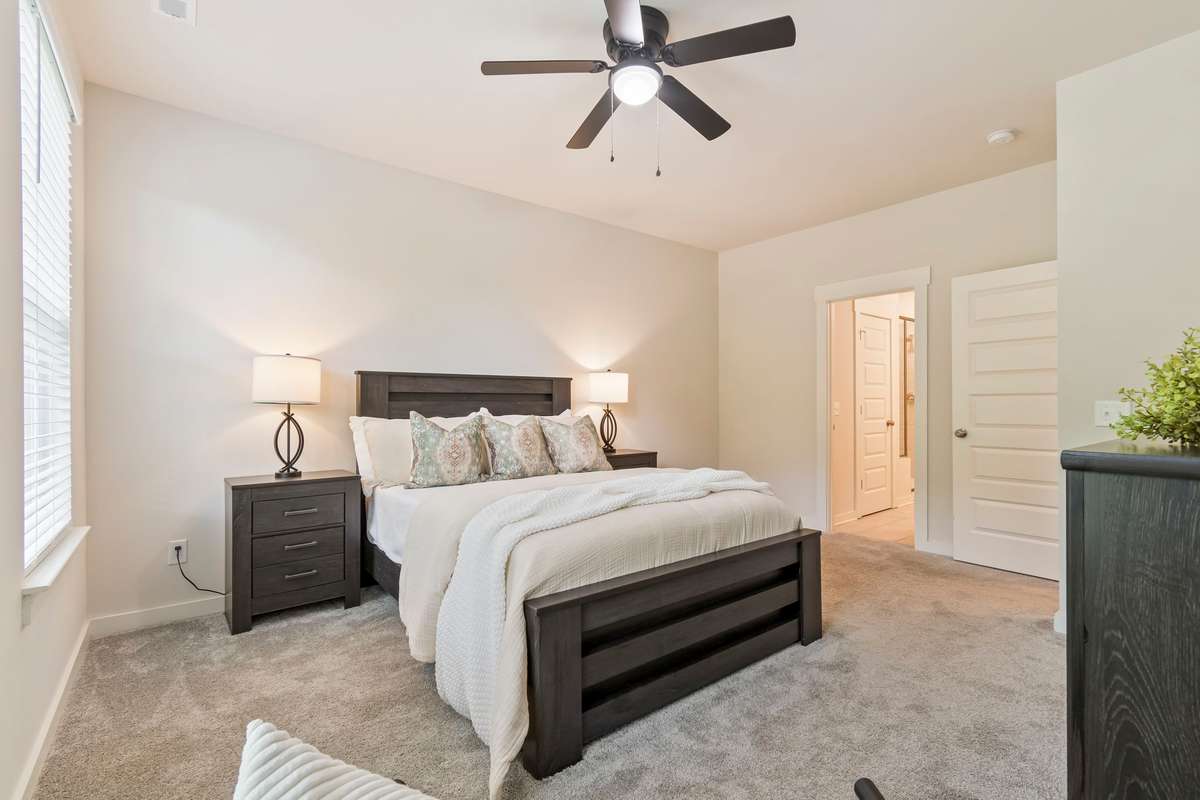 This primary suite provides a private retreat, while additional bedrooms offer flexibility for guests, a home office, or hobbies.