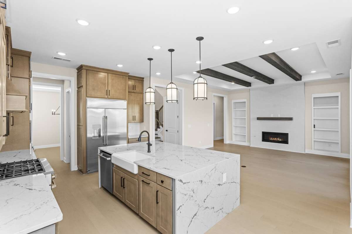 another view of gourmet kitchen and family room