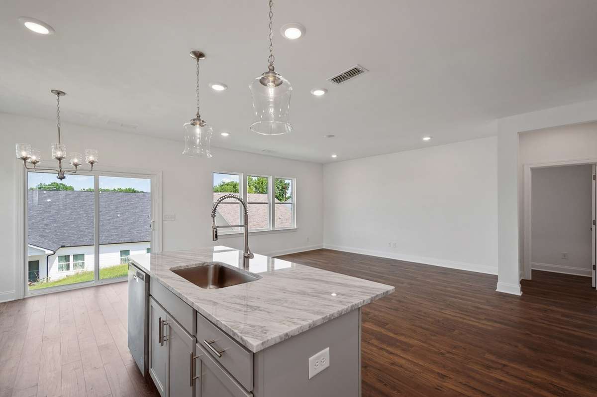 Ample space for entertainment / hosting friends + family to gather in this wide-open room.