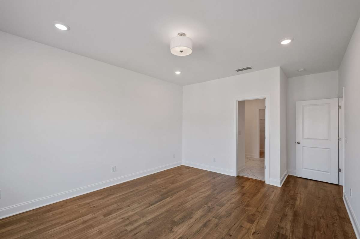 Tucked in the rear corner for maximum privacy, the owner's suite is a true retreat...