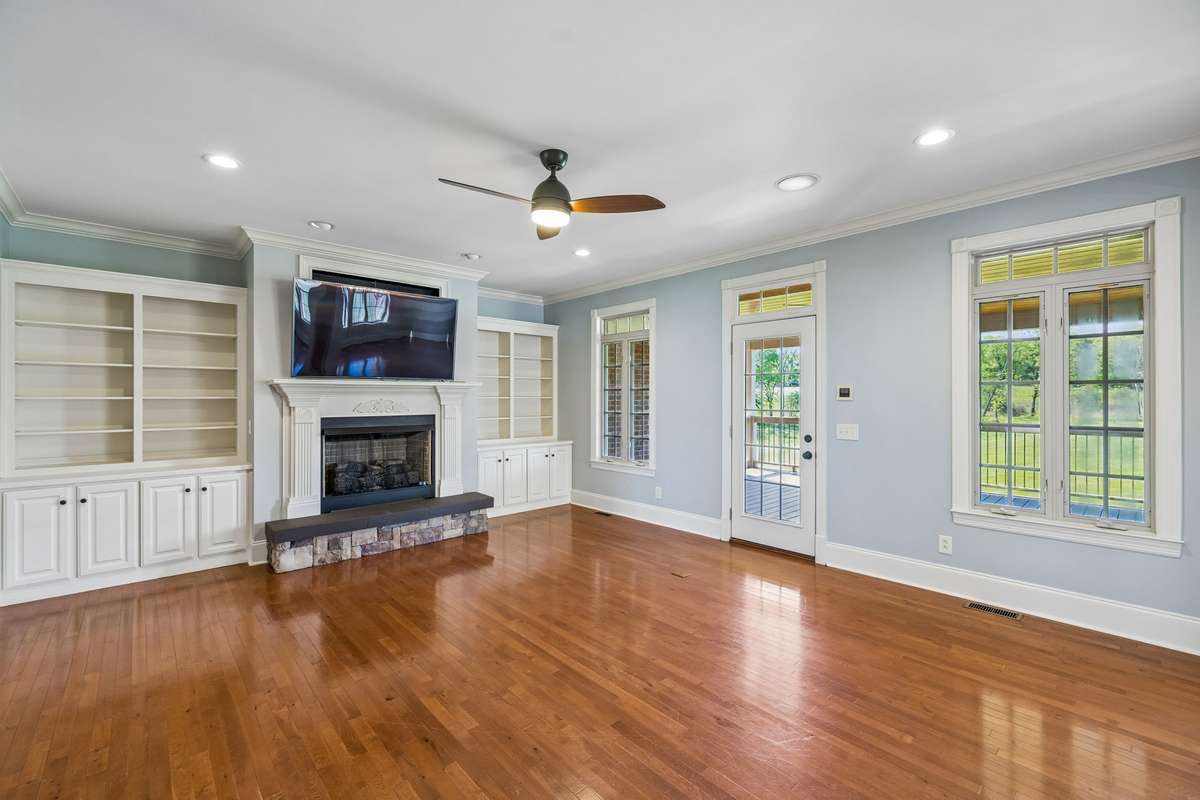 Fireplace(not burning) built in Shelving with Covered Patio just outside the the door.