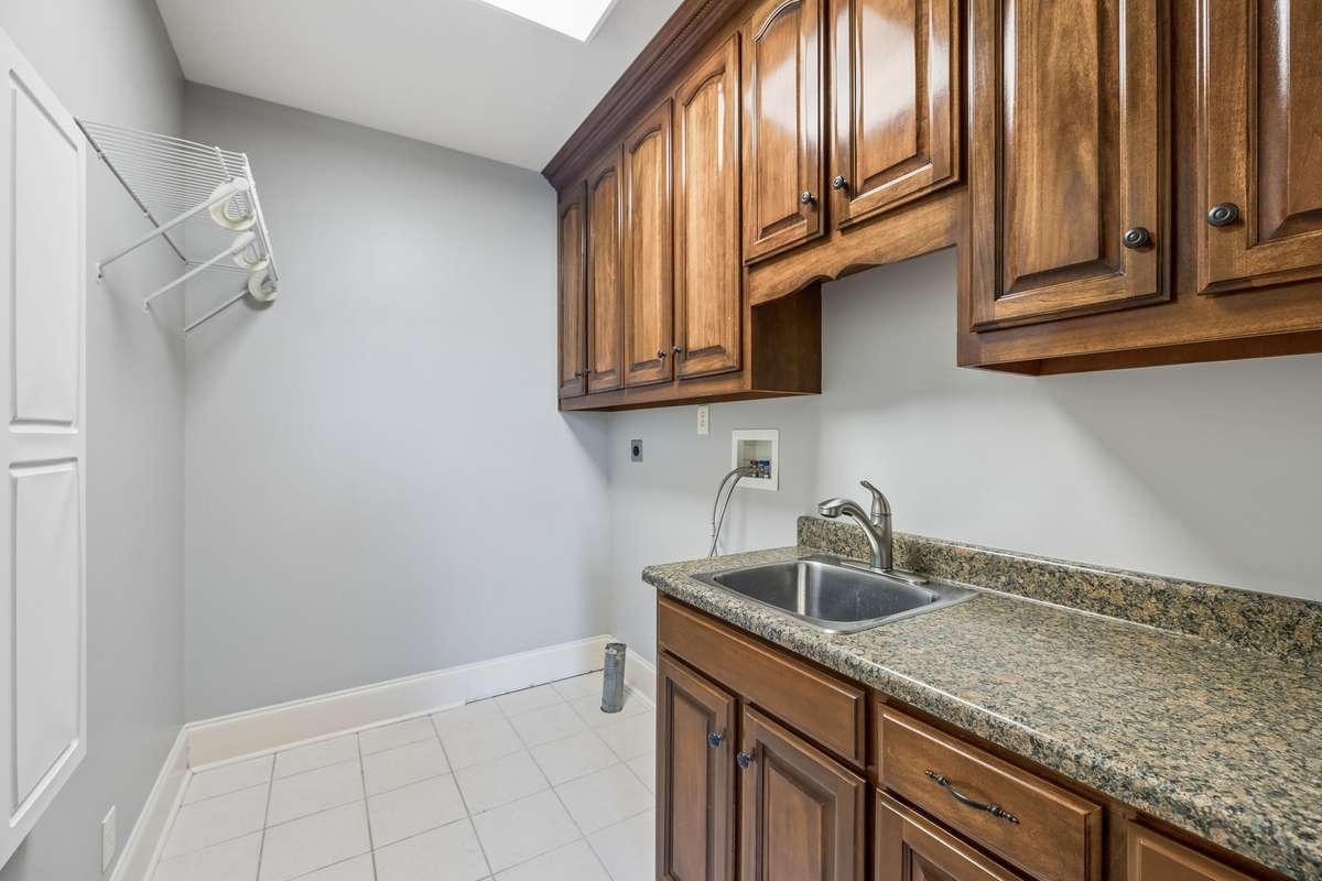 Laundry Room with Utility Sink to the right after entering the kitchen from the Garage