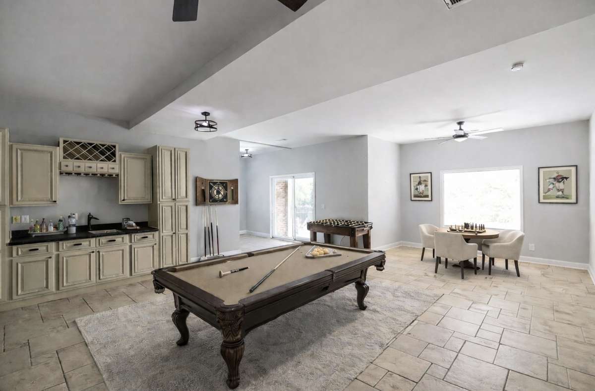 Game nights. Friendly competition. Endless entertainment.
The finished lower level offers ample space to play, relax, and host — no matter the season.