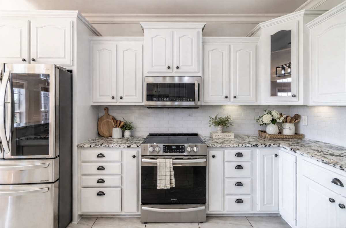 Elegant countertops, premium appliances, and a layout that keeps everyone part of the story.
