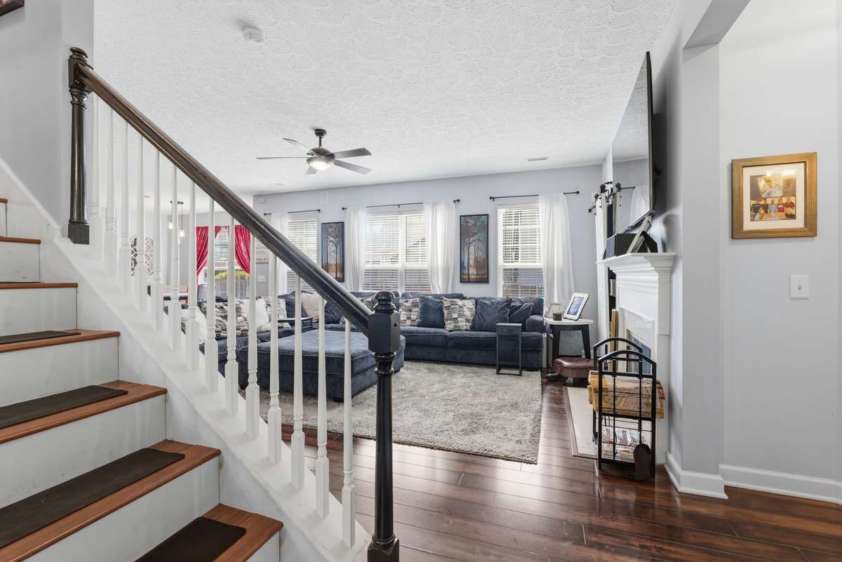 View into den . . .with hardwood and hardwood stairs!