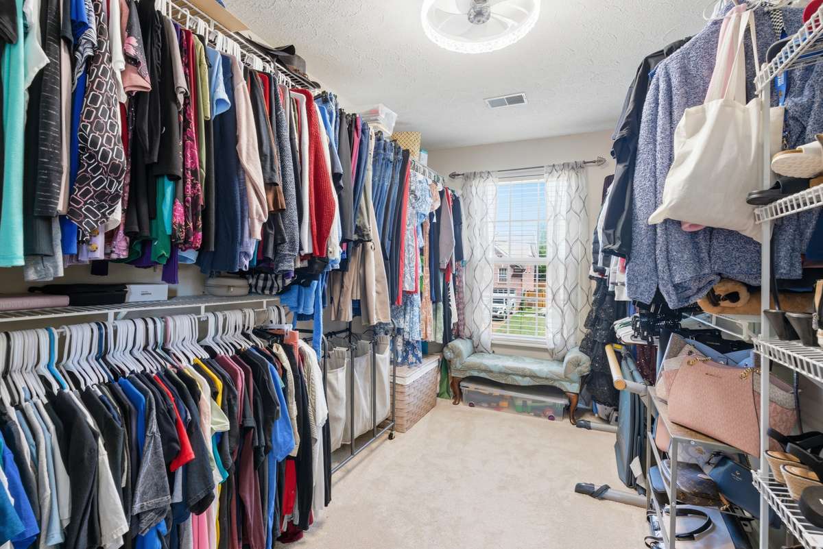 One of the walk-in closets for the primary bedroom.  Storage room located off this closet.  Separate large laundry room upstairs