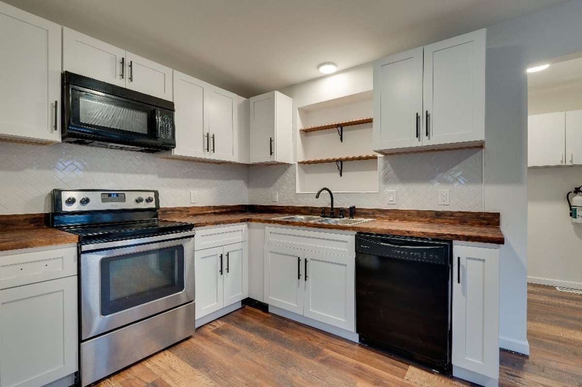 Updated kitchen with newer cabinets, butcher block