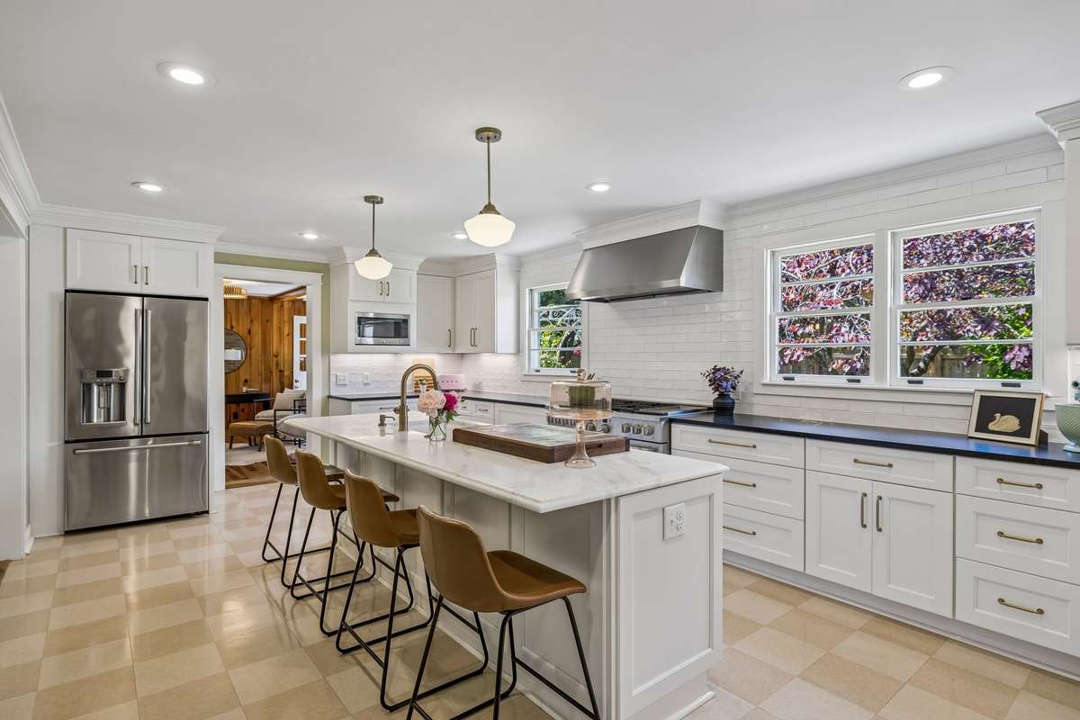 The home is anchored by a true chef's kitchen optimized for workflow and tailored for storage.
