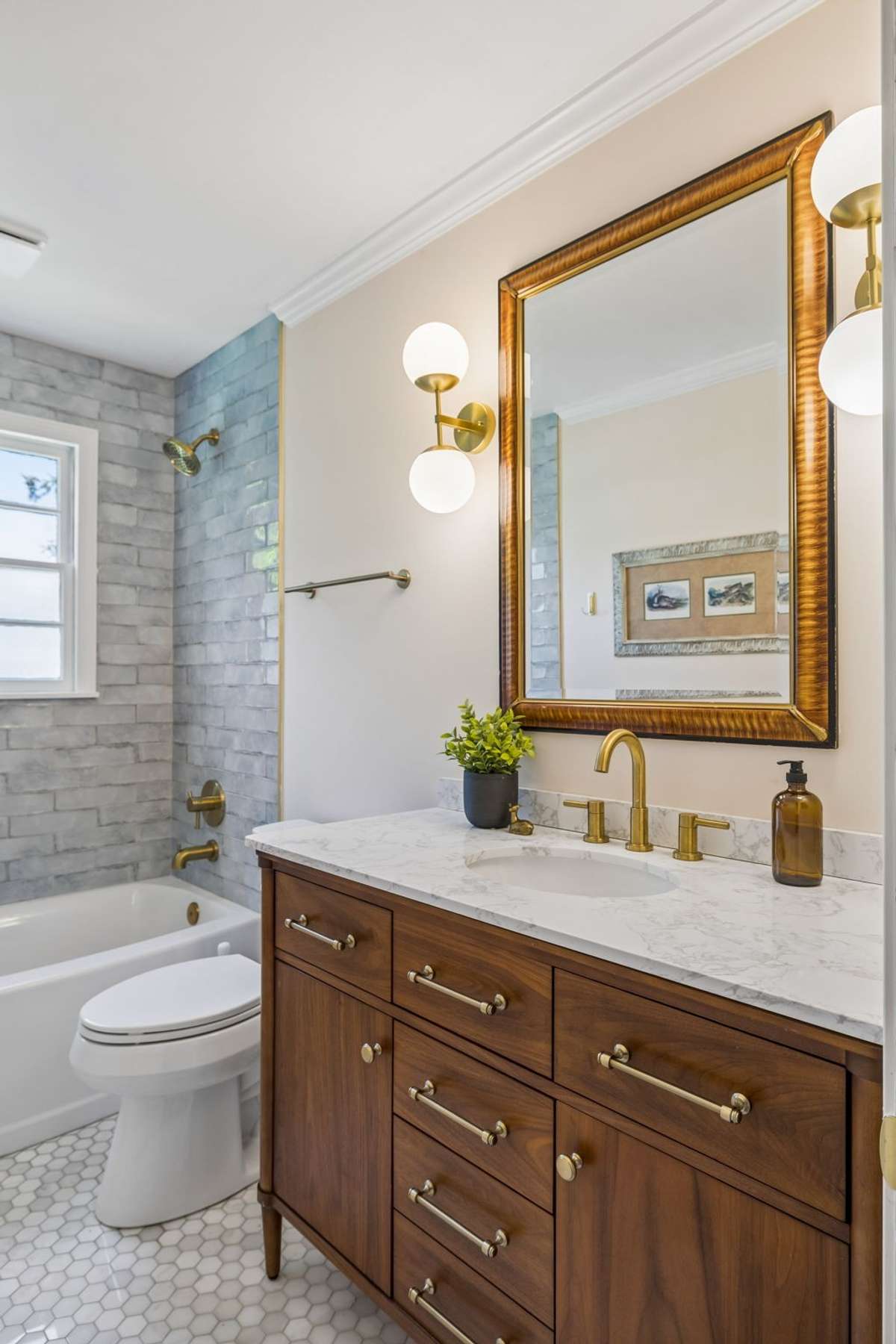 A bright and well-appointed second full bath.