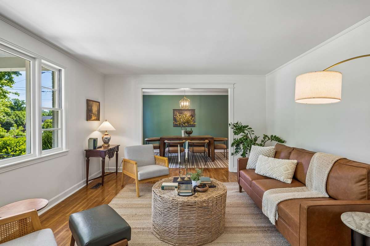 The airy front room transitions beautifully into formal dining space.