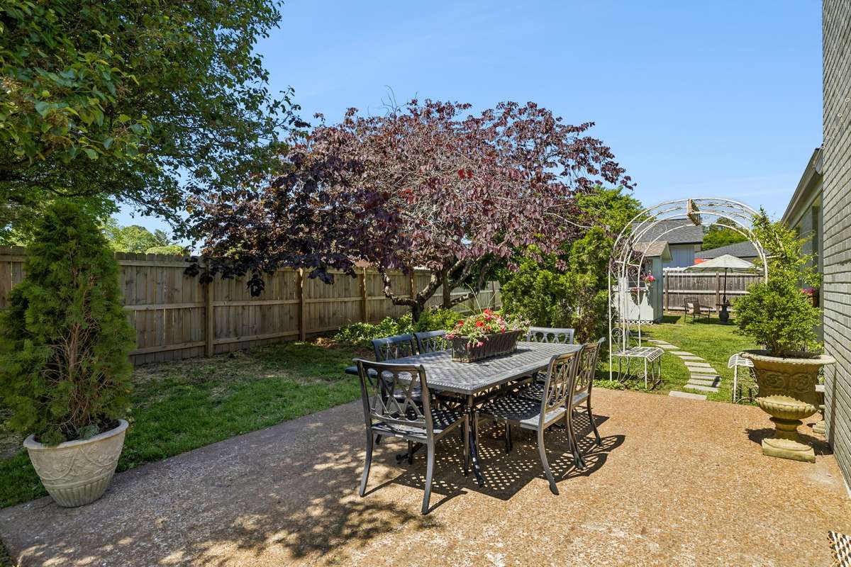 The perfect alfresco setup: a generous patio space primed for grilling, dining, and effortless outdoor entertaining.