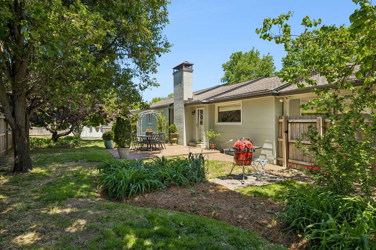 Nestled on a .32-acre lot, enjoy a private backyard with mature beds and trees.