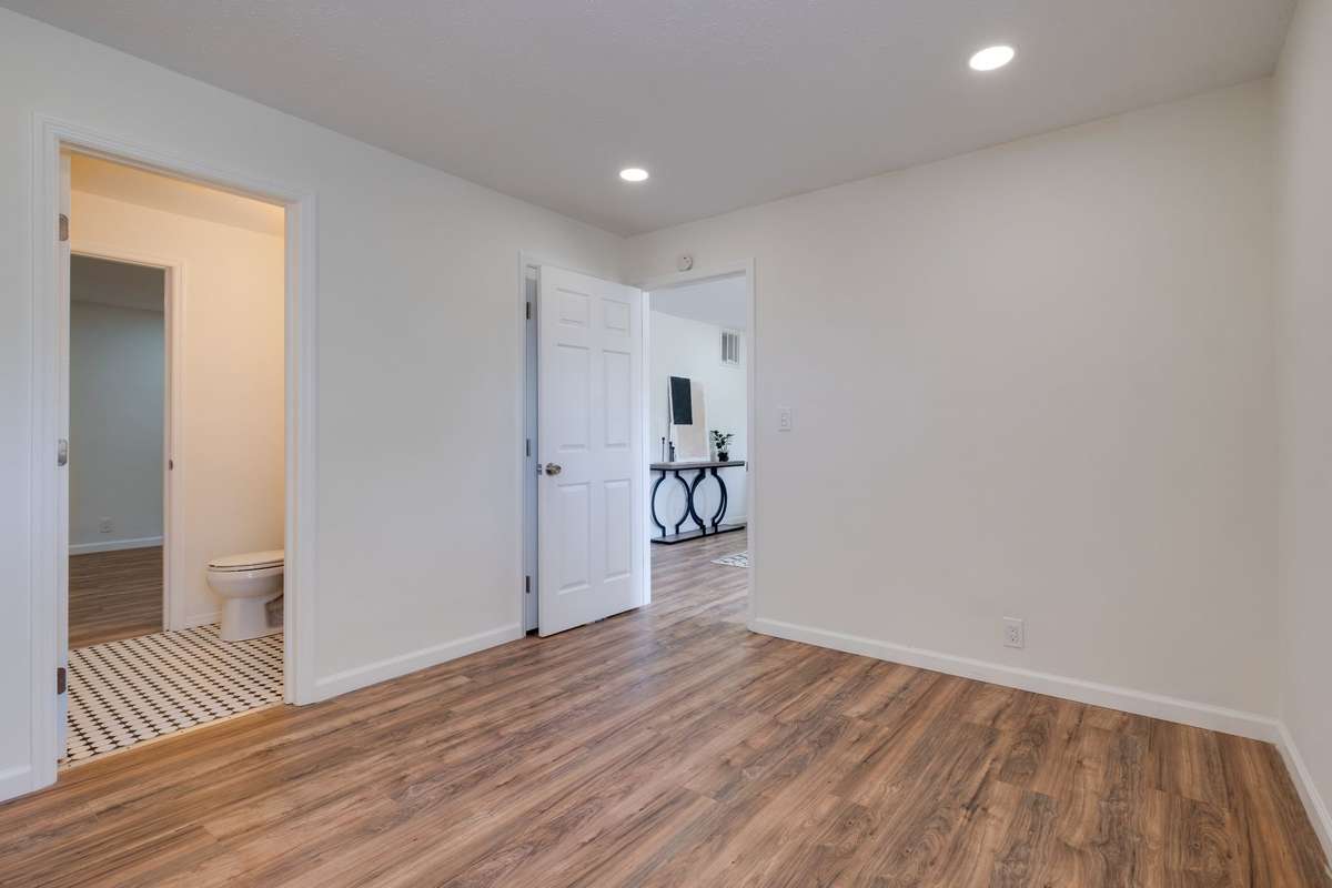 Unit B bedroom 2. Full bath to the left and living room ahead