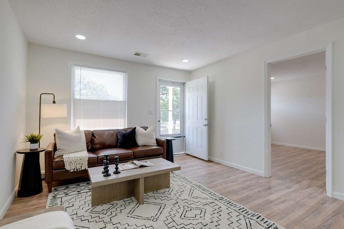 Unit B living room towards entry with bedroom to the right