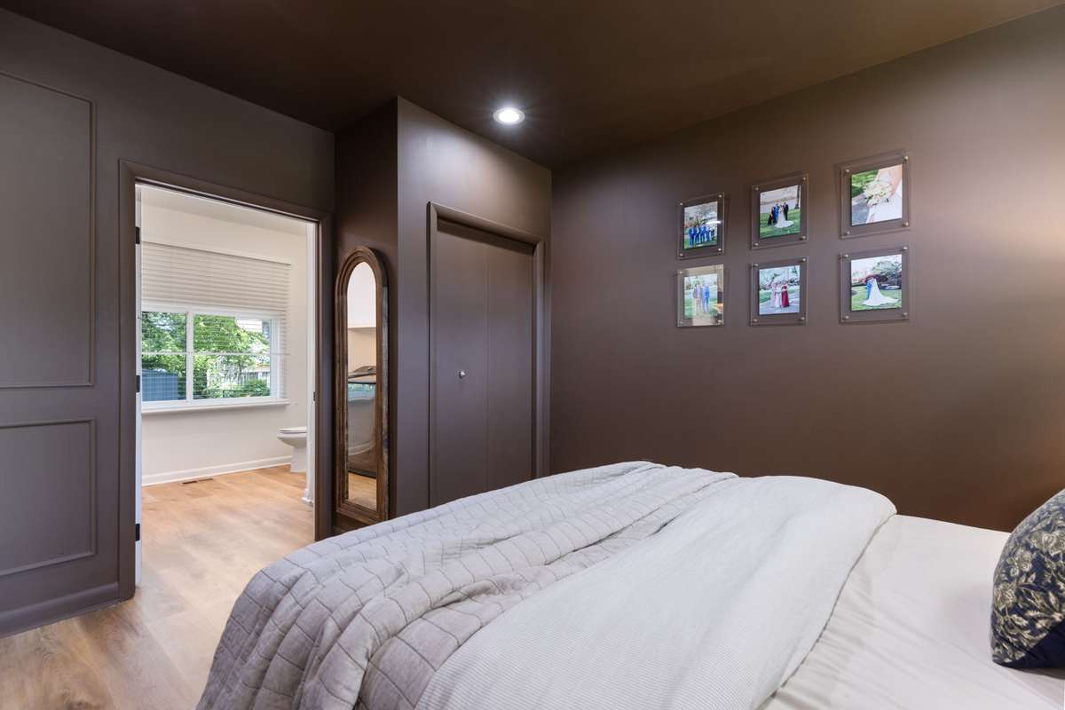 Private, primary bedroom situated on the opposite side of the home from the 3 secondary bedrooms. Primary bedroom with an elevated style including wainscoting trim, recessed lighting, and LVP flooring.