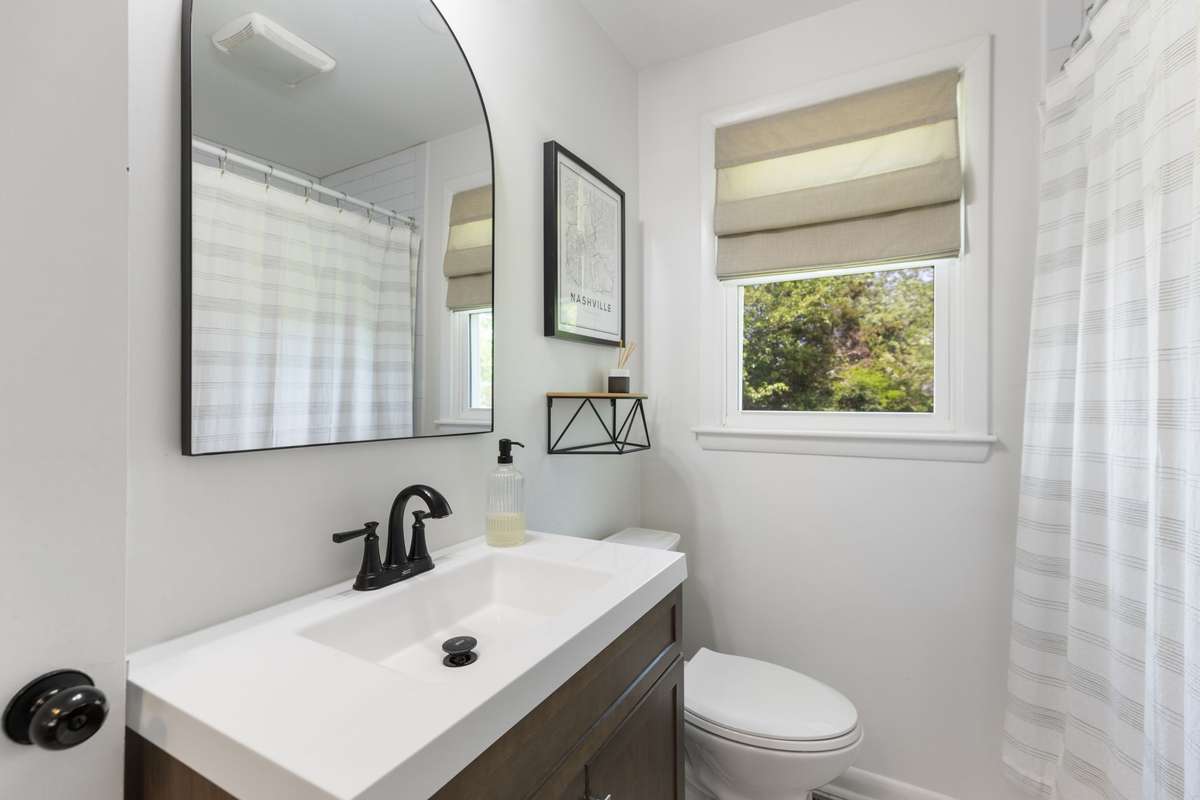 The bedroom hallway full bathroom has a tiled shower/tub combo.
