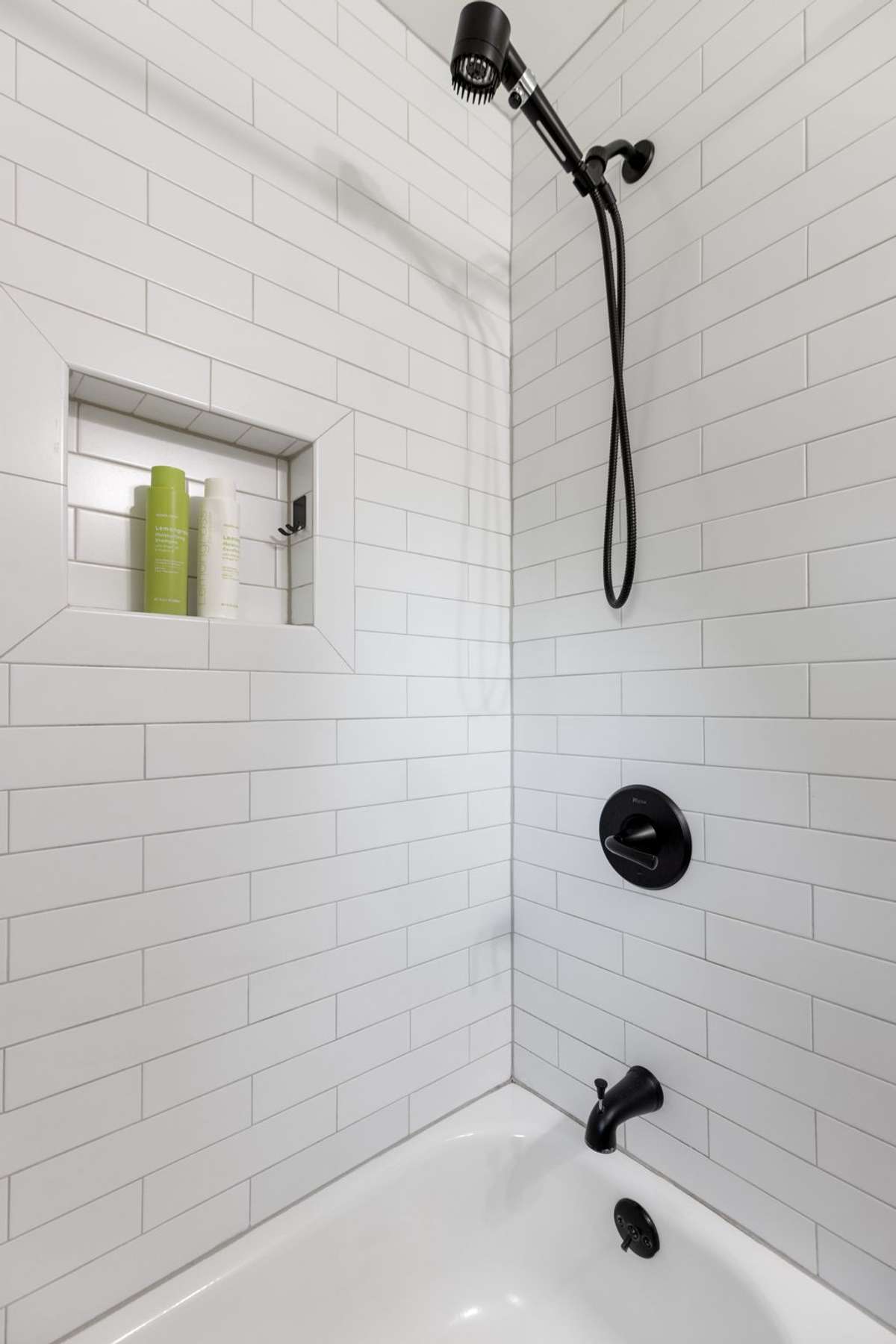 The bedroom hallway full bathroom has a tiled shower/tub combo.
