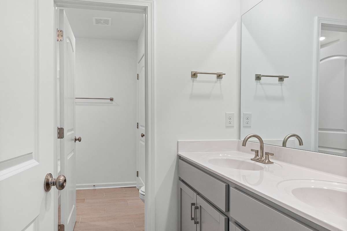 This is a photo of one of our model homes. Please know that some of the exterior and interior finishes, paint, and features may vary.