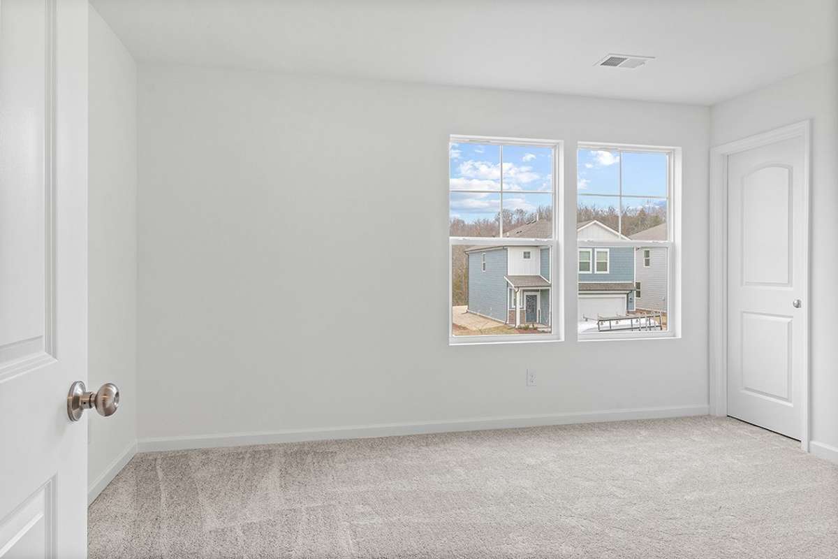 This is a photo of one of our model homes. Please know that some of the exterior and interior finishes, paint, and features may vary.