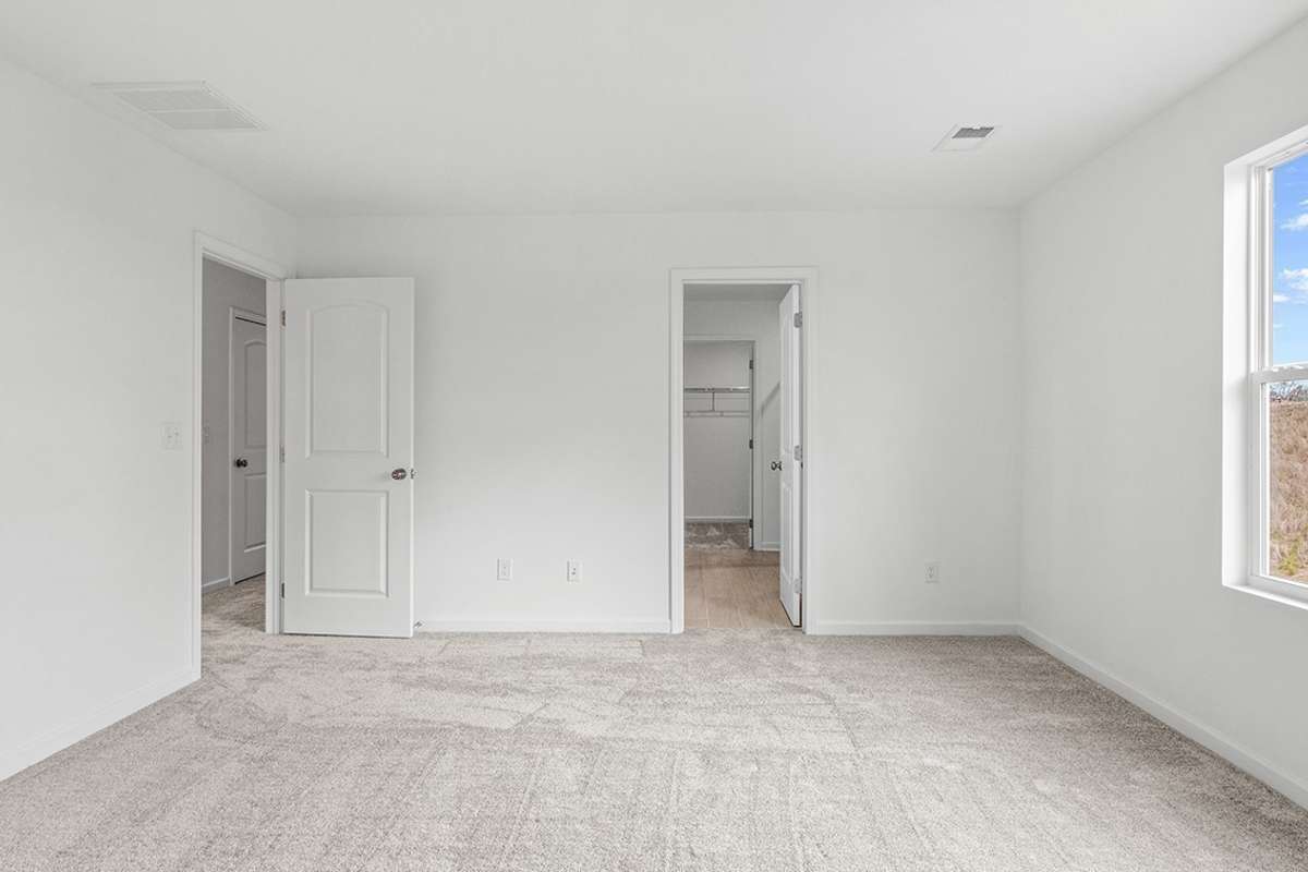 This is a photo of one of our model homes. Please know that some of the exterior and interior finishes, paint, and features may vary.