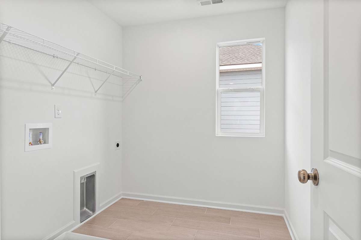 This is a photo of one of our model homes. Please know that some of the exterior and interior finishes, paint, and features may vary.