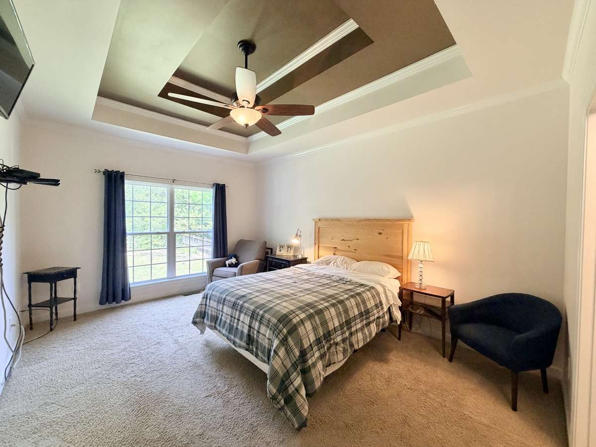 Master bedroom on the main level. Trey ceilings with full bath attached.