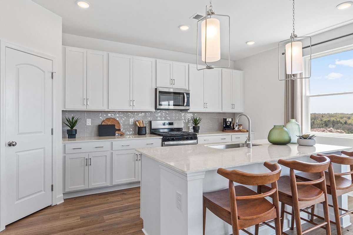 This is a photo of one of our model homes. Please know that some of the exterior and interior finishes, paint, and features may vary.